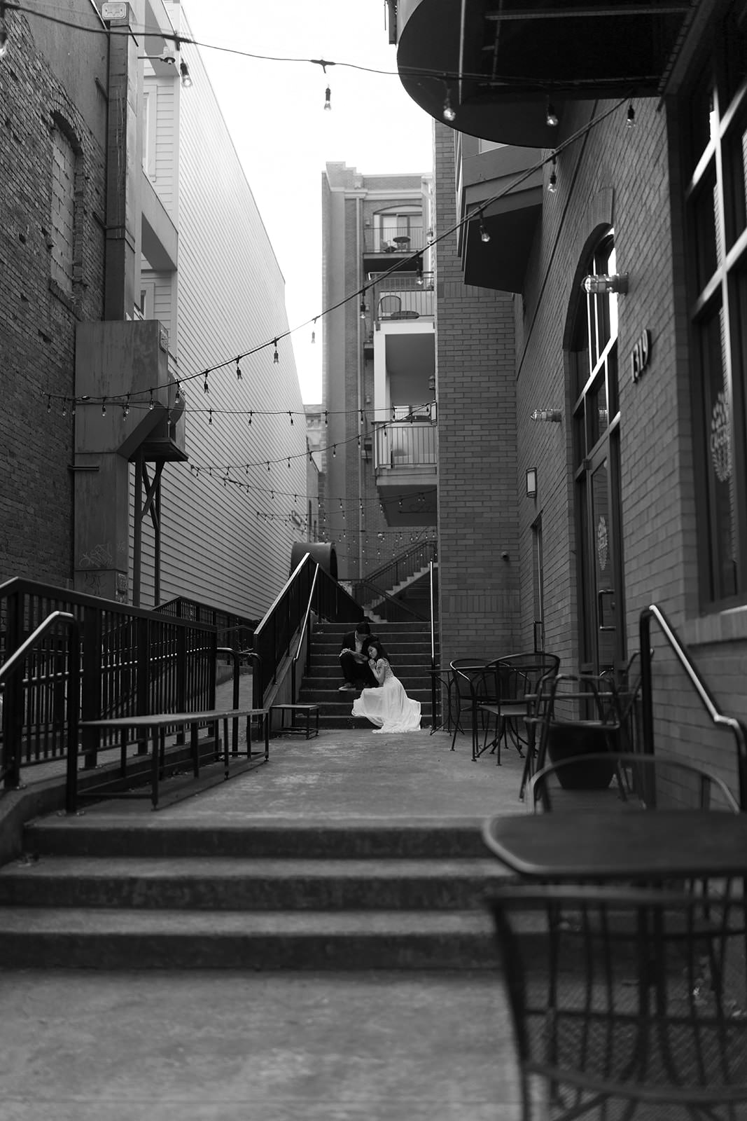 bride and groom walking dog through hoy arboretum